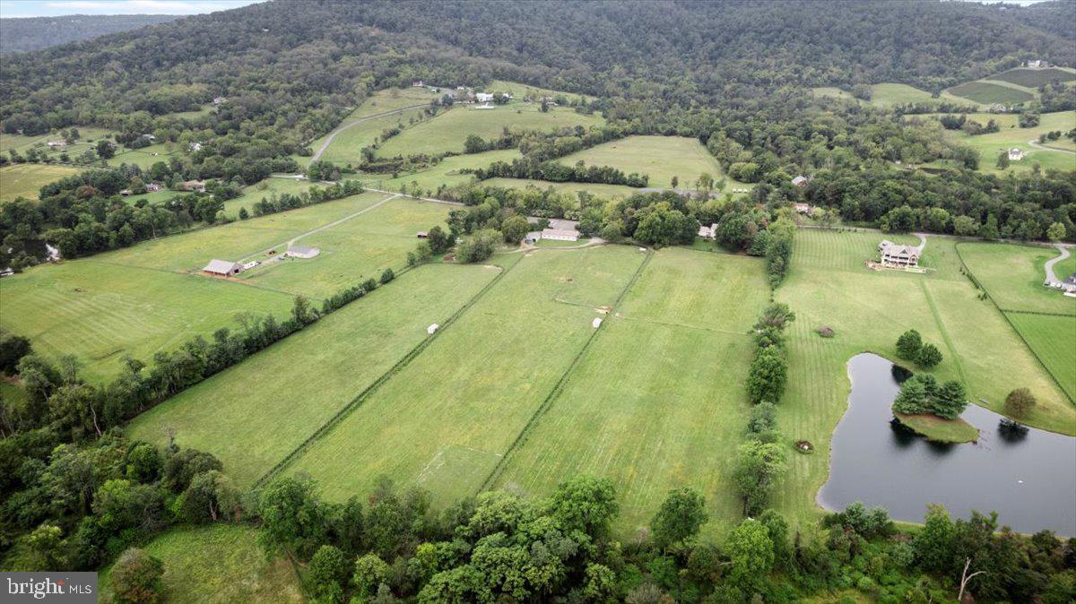 19606 Ridgeside Road Bluemont, VA 20135 - Photo 55 of 81 a view of a lake with a yard