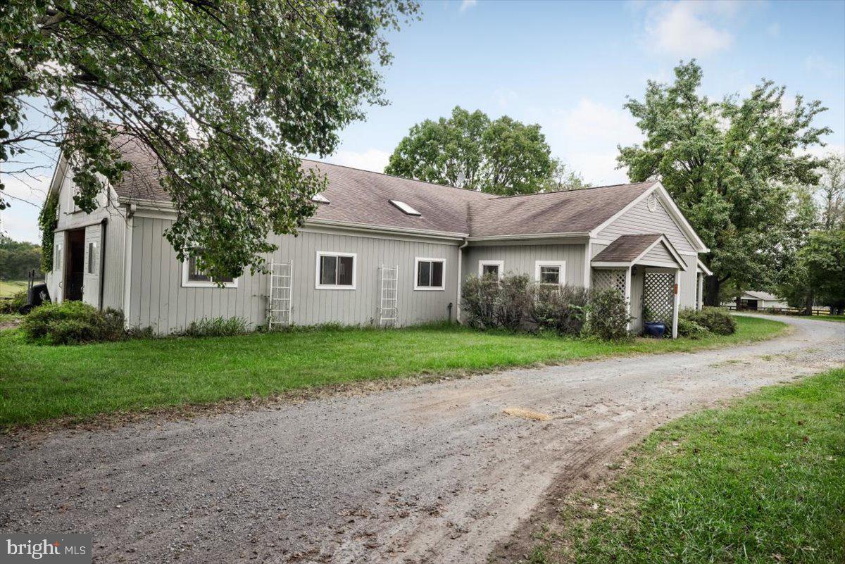 19606 Ridgeside Road Bluemont, VA 20135 - Photo 67 of 81 a front view of a house with a yard and trees