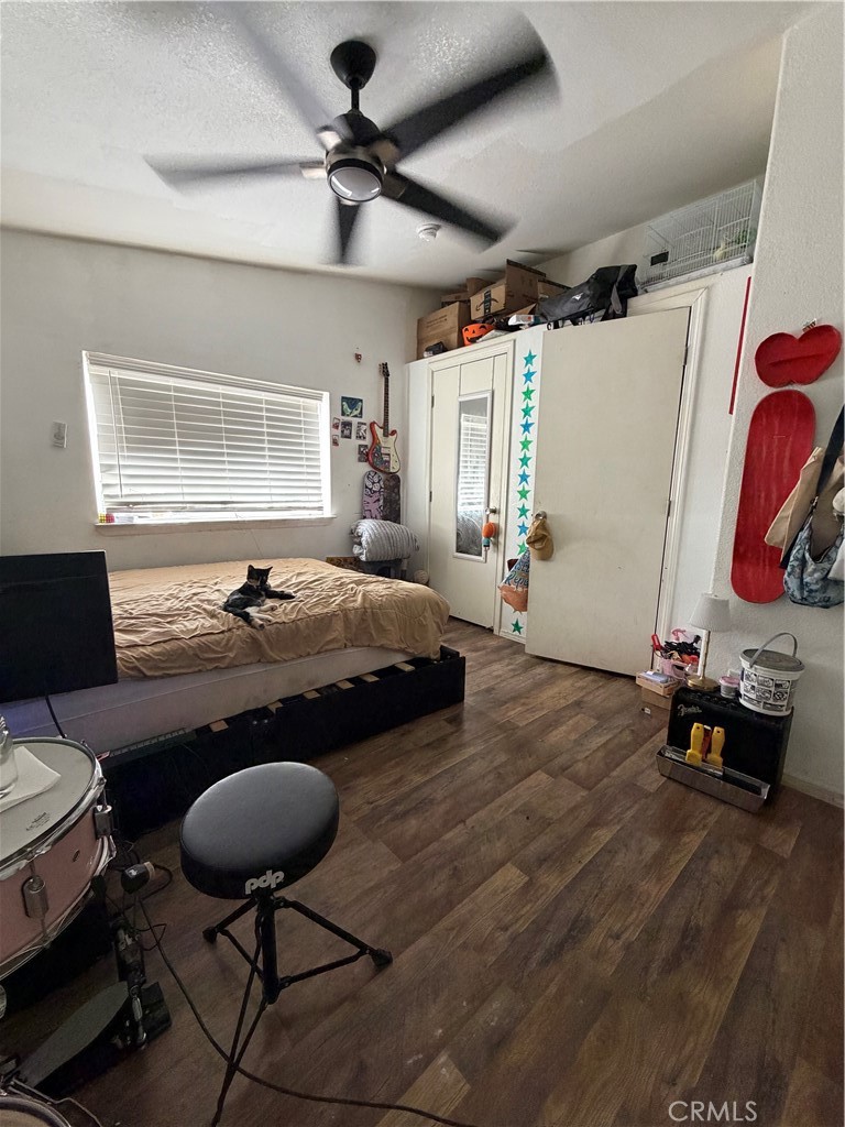 20401 Soledad Canyon Road, Unit 406 Canyon Country, CA 91351 - Photo 15 of 16 a bedroom with furniture and a chair