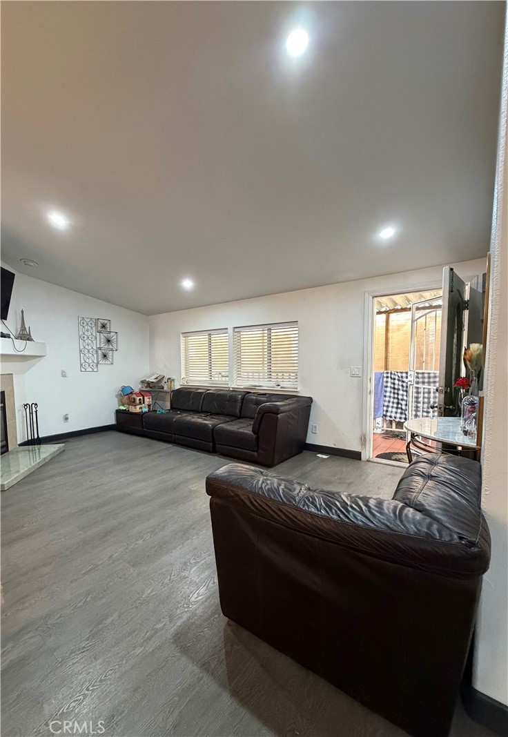 20401 Soledad Canyon Road, Unit 406 Canyon Country, CA 91351 - Photo 6 of 16 a living room with furniture and a wooden floor