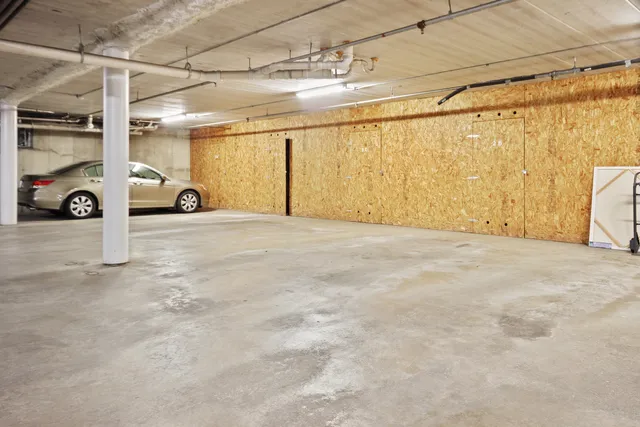 a view of parking garage with cars