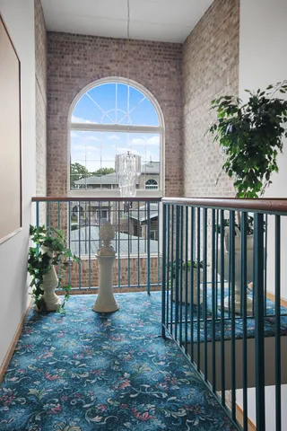 a view of a pathway with a balcony