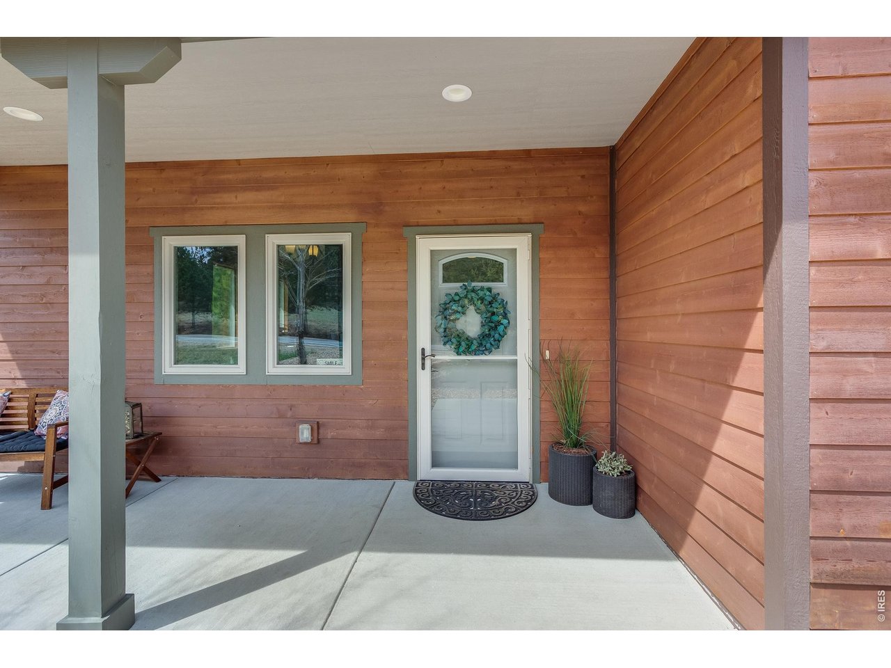2209 Fish Creek Road Estes Park, CO 80517 - Photo 3 of 50 Welcome home. The covered front porch provides a warm and inviting entrance to this mountain retreat.