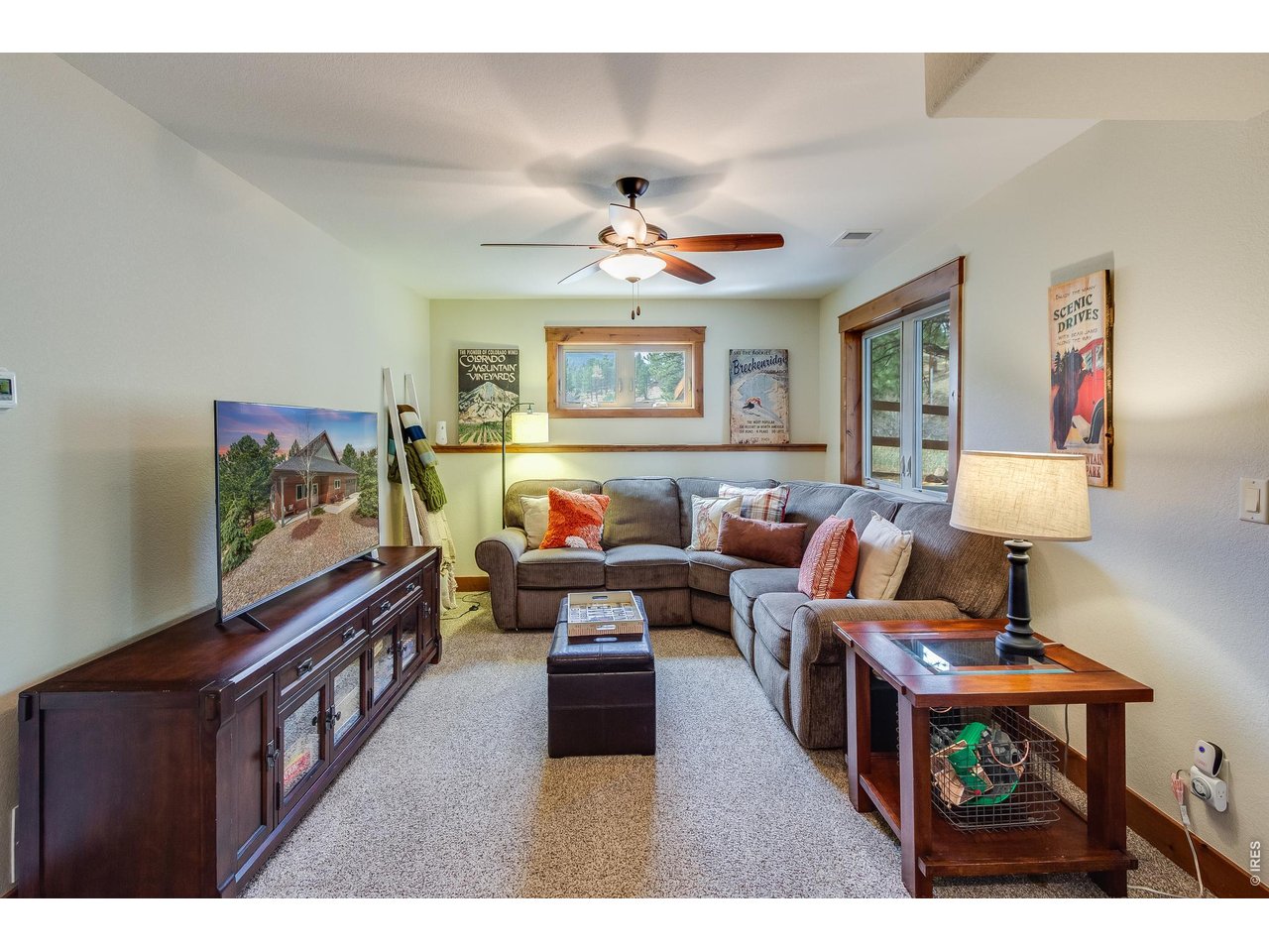 2209 Fish Creek Road Estes Park, CO 80517 - Photo 32 of 50 Versatile lower-level family room or media space, perfect for movie nights and gaming.