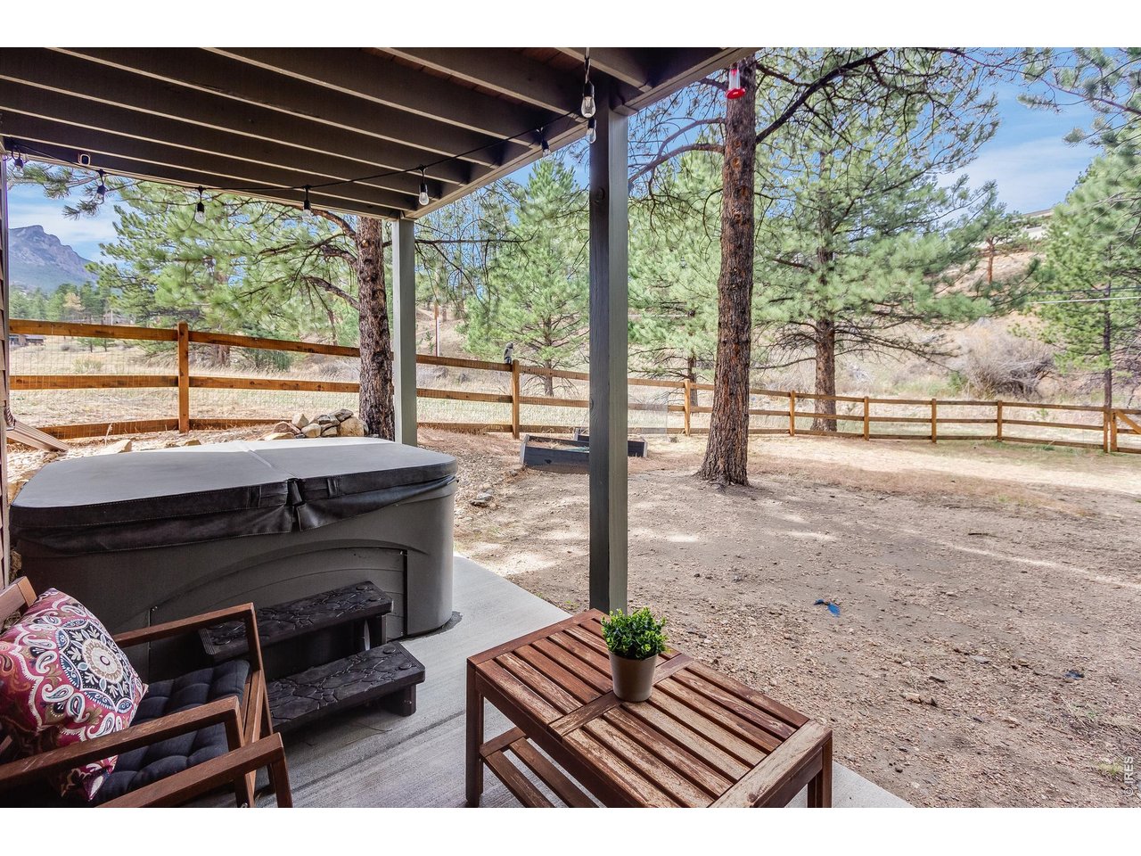 2209 Fish Creek Road Estes Park, CO 80517 - Photo 40 of 50 Covered lower-level patio an ideal setting entertaining and enjoying beautiful mountain weather.