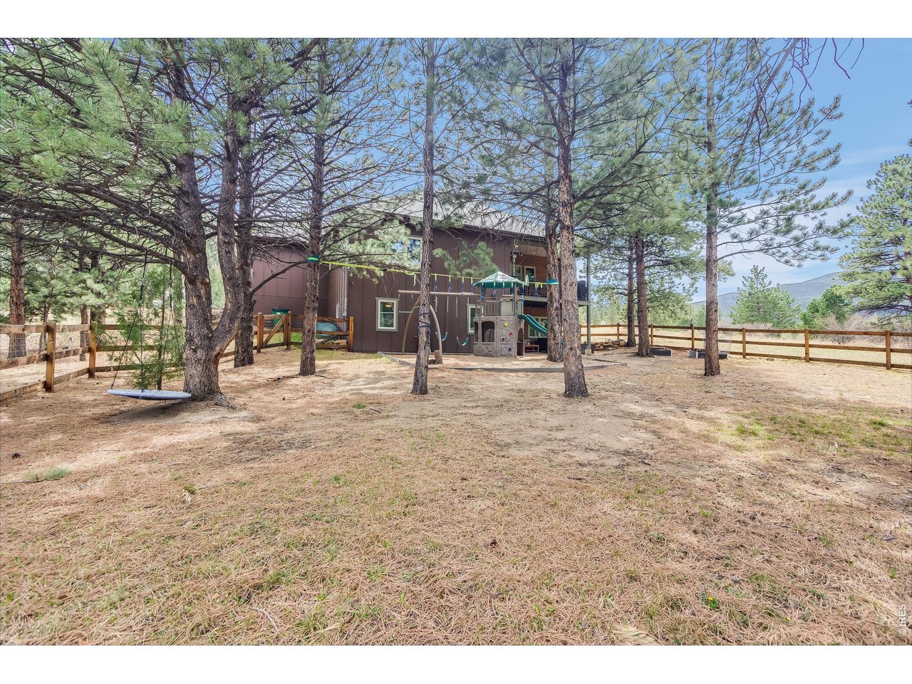 2209 Fish Creek Road Estes Park, CO 80517 - Photo 43 of 50 Large, fenced backyard providing a safe and secure area.