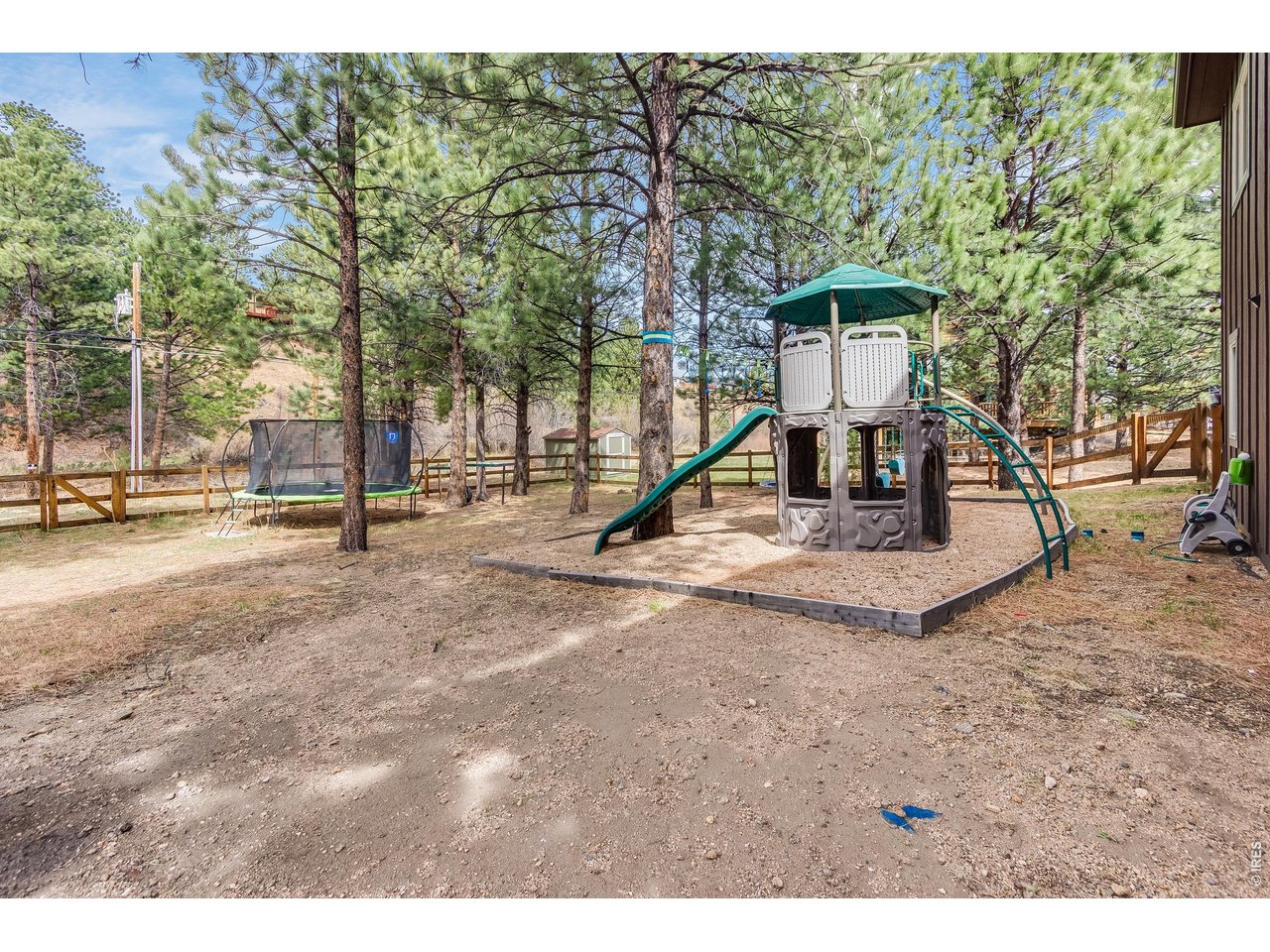 2209 Fish Creek Road Estes Park, CO 80517 - Photo 44 of 50 Ample room in the fenced backyard offers a flexible and versatile outdoor area.
