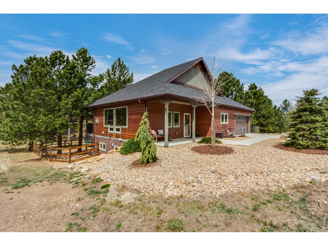 2209 Fish Creek Road Estes Park, CO 80517 - Photo 45 of 50 Classic wood and stone aesthetic situated on a beautifully landscaped, sun-drenched lot.