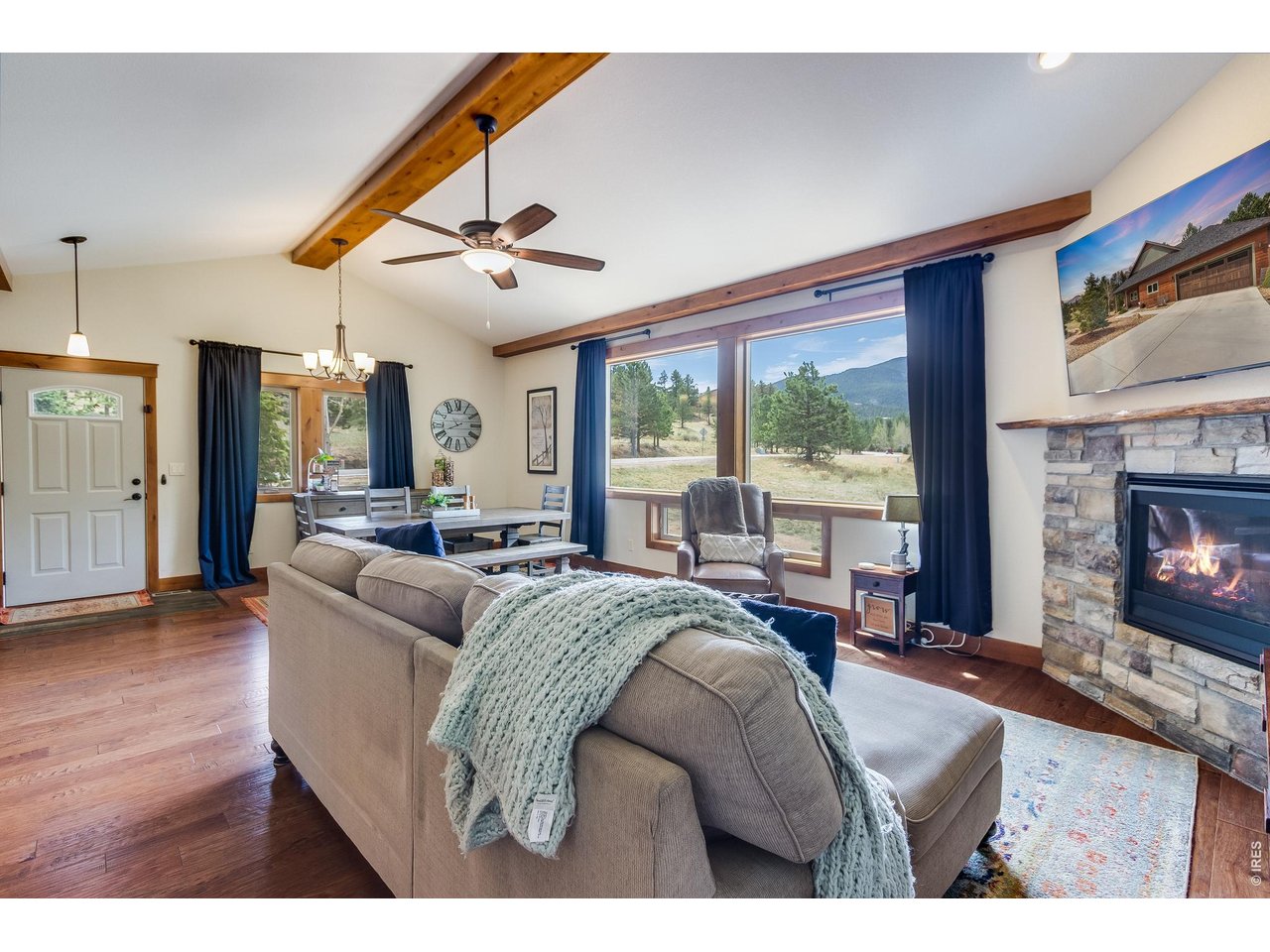 2209 Fish Creek Road Estes Park, CO 80517 - Photo 7 of 50 Spacious dining area seamlessly flows into the living area, perfect for entertaining.
