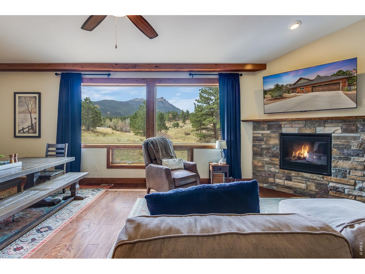 2209 Fish Creek Road Estes Park, CO 80517 - Photo 8 of 50 Relax by the fire while enjoying peaceful views of the mountains and surrounding pines.