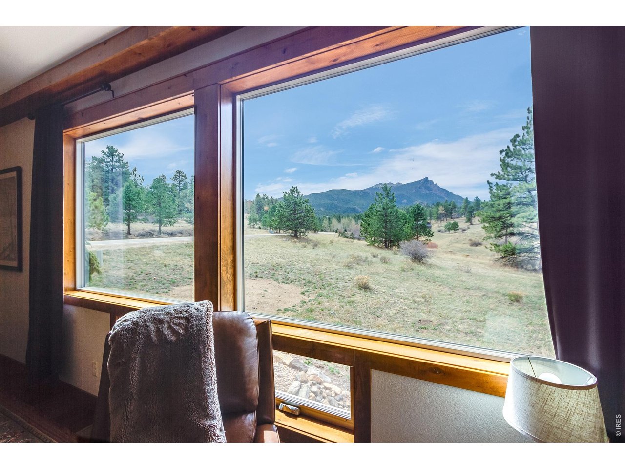 2209 Fish Creek Road Estes Park, CO 80517 - Photo 9 of 50 Breathtaking picture window views of the iconic Twin Sisters Peaks.