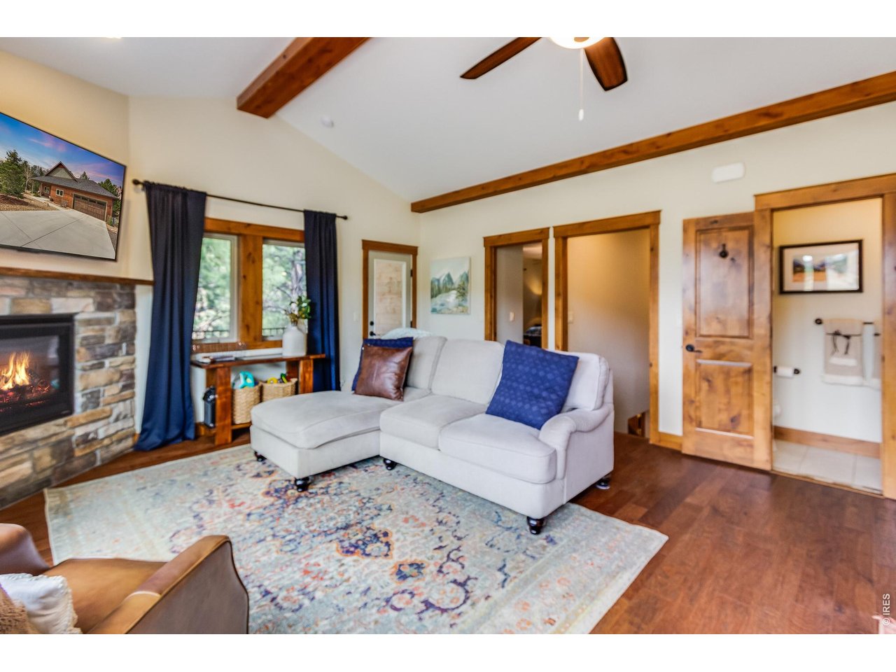 2209 Fish Creek Road Estes Park, CO 80517 - Photo 10 of 50 Spacious living area with direct access to the deck, creating a seamless entertaining flow.