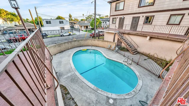 an aerial view of a house with swimming pool