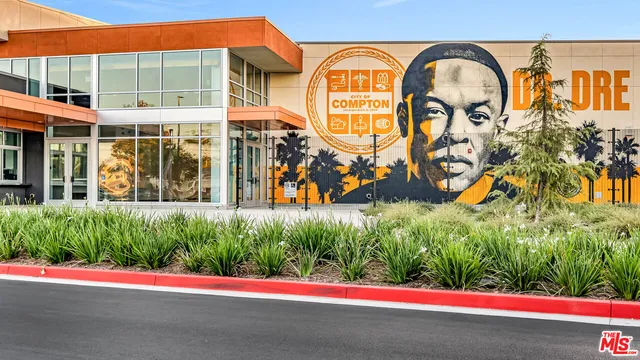 a view of swimming pool with a yard and plants