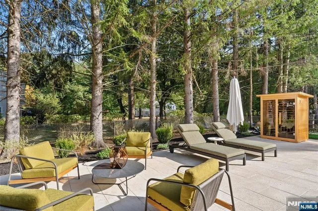 a view of swimming pool with lounge chairs