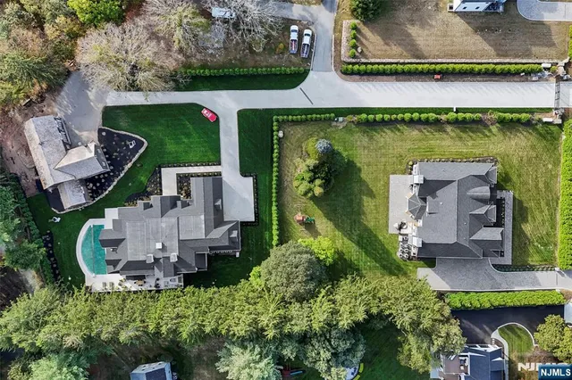 an aerial view of house with yard swimming pool and outdoor seating