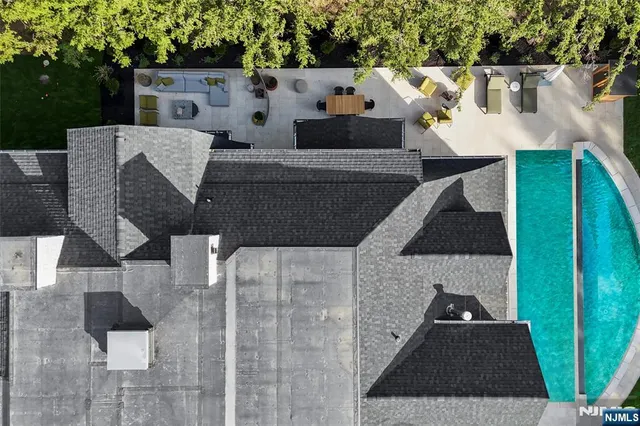 a terrace of a house with table and chairs