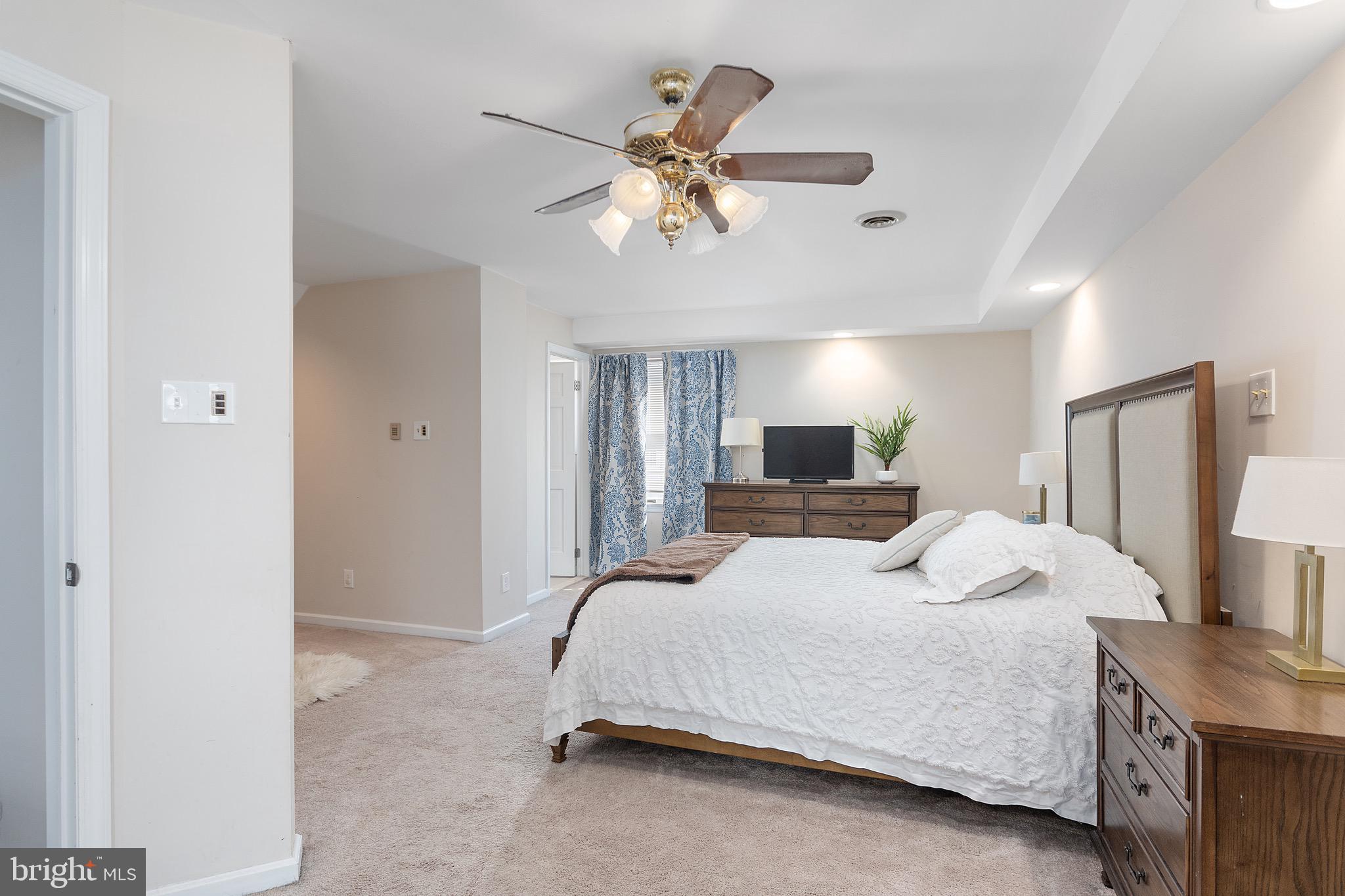 34 South Fellowship Road Maple Shade, NJ 08052 - Photo 22 of 27 a bedroom with a bed and a chandelier