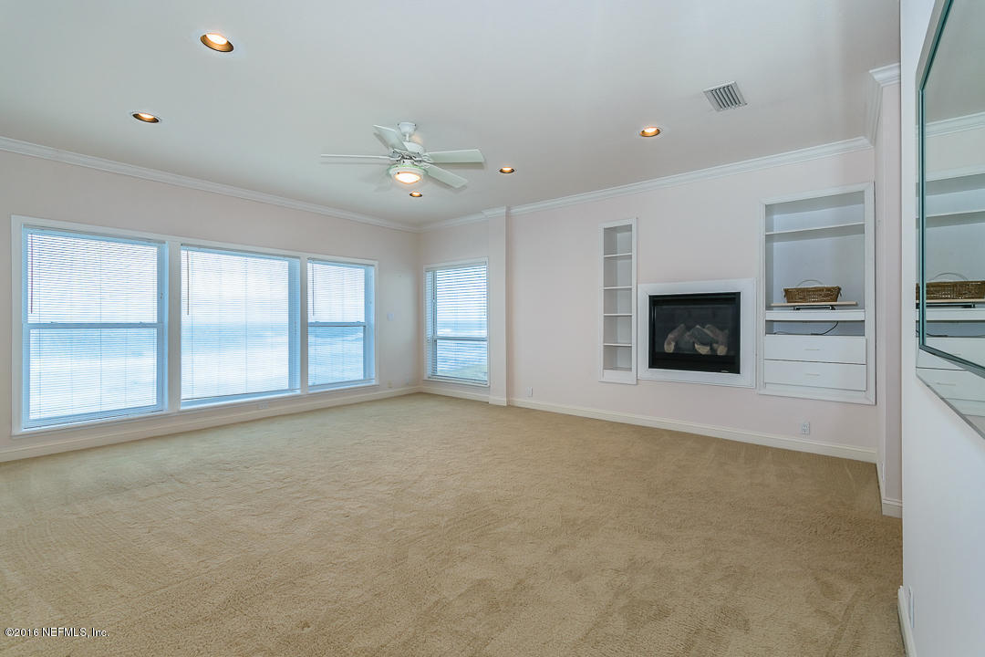 1626 Strand Street Neptune Beach, FL 32266 - Photo 18 of 51 an empty room with windows and fireplace