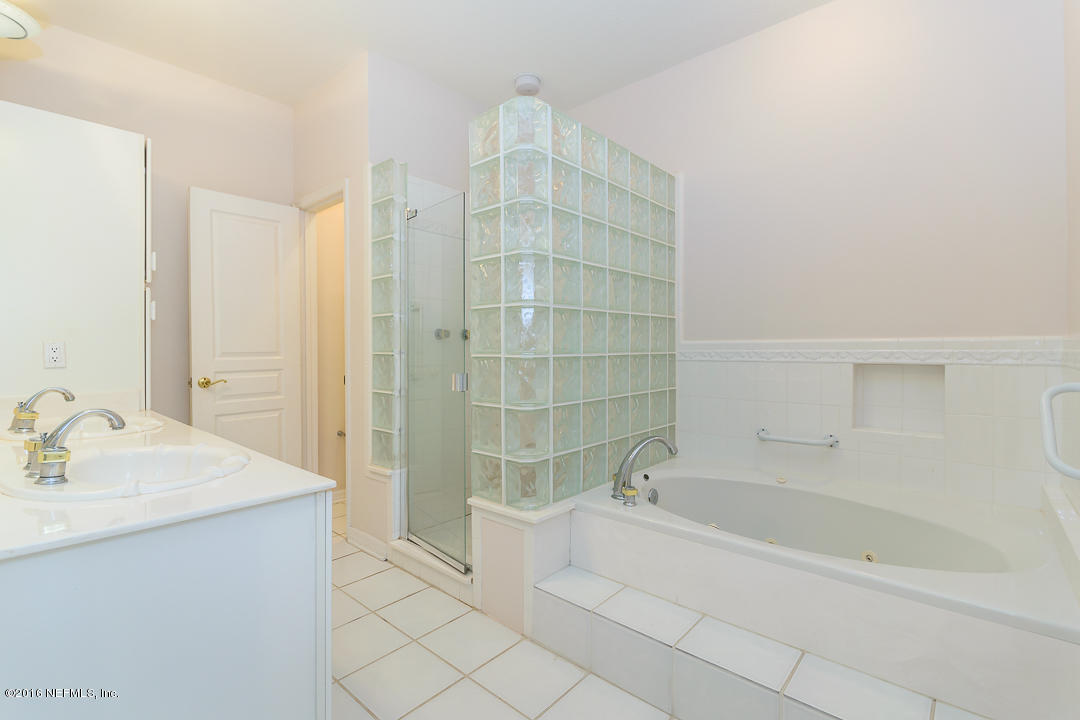 1626 Strand Street Neptune Beach, FL 32266 - Photo 20 of 51 a bathroom with a bathtub and a sink