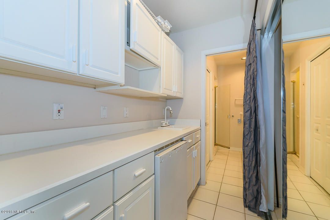 1626 Strand Street Neptune Beach, FL 32266 - Photo 8 of 51 a view of a kitchen with white cabinets