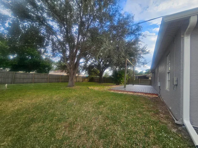 a view of backyard with green space