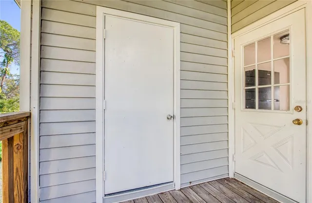 a view of front door and wooden door