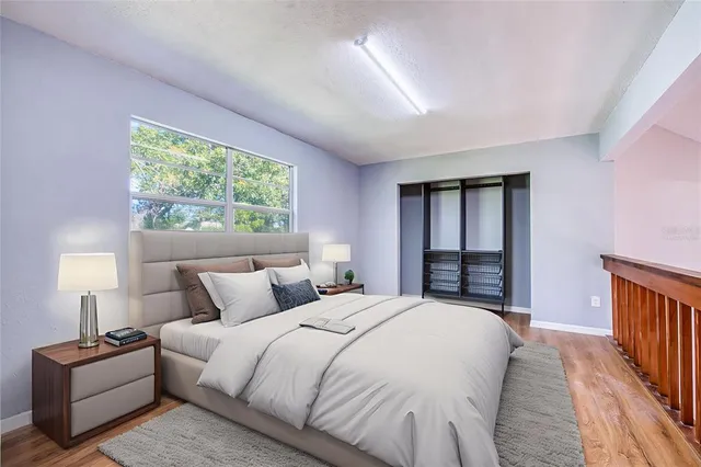 a bed room with a bed and a lamp