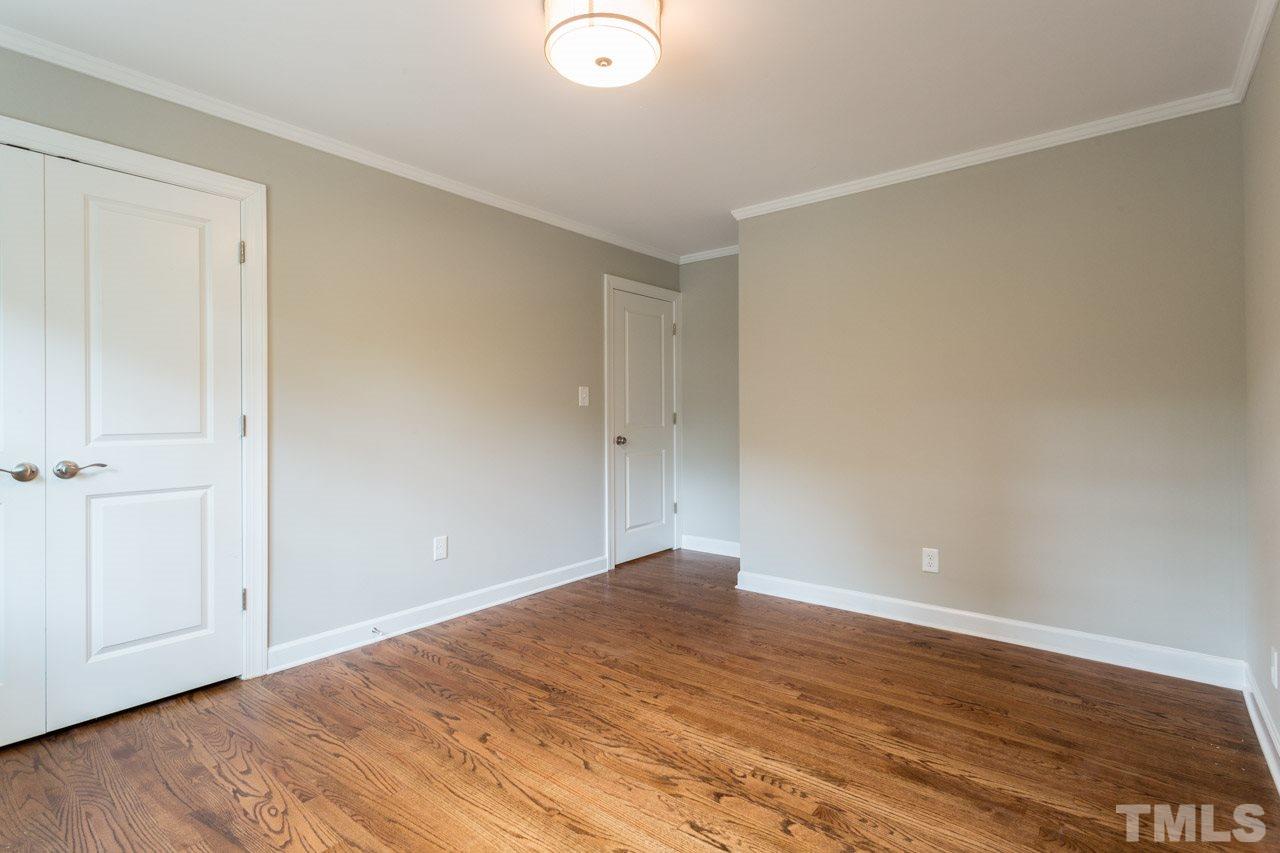 1509 Shadowood Lane Raleigh, NC 27612 - Photo 15 of 25 a view of empty room with wooden floor