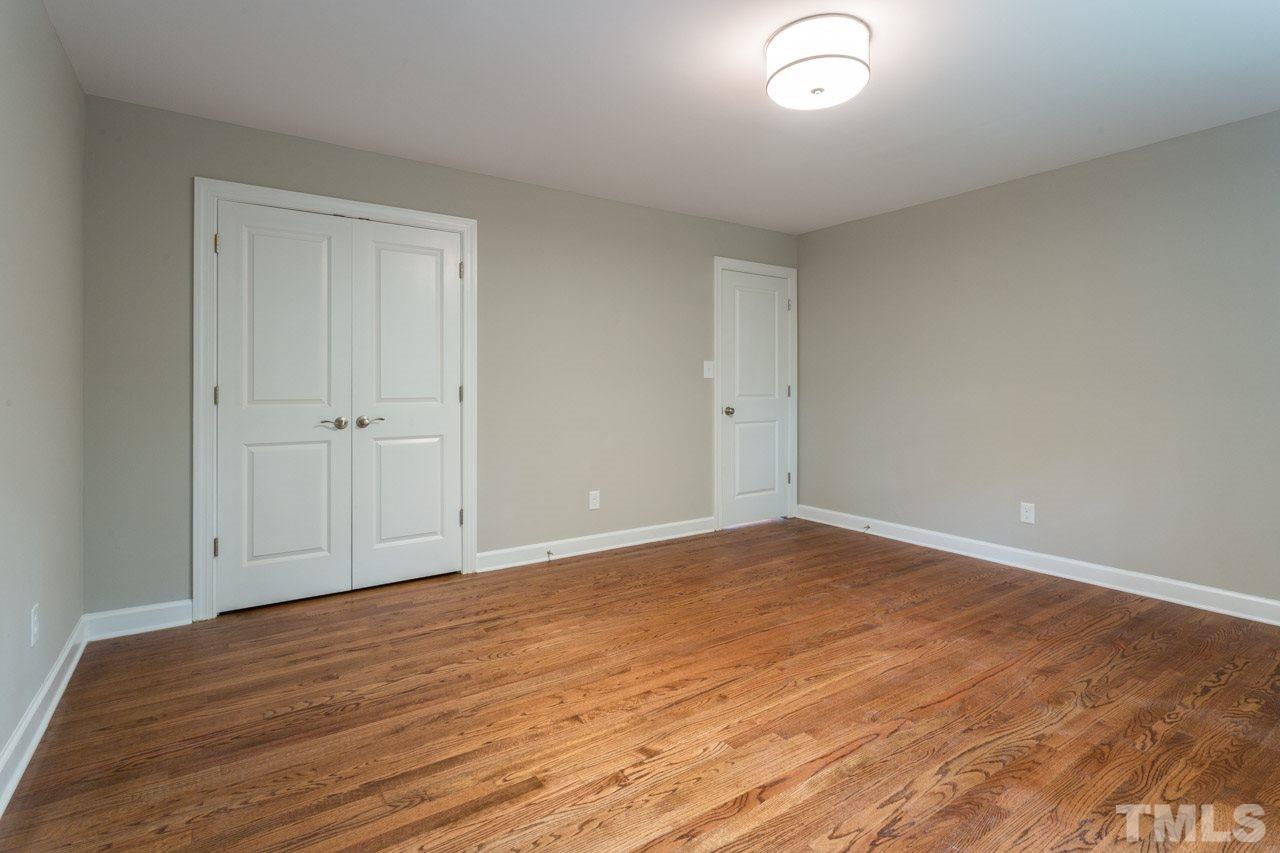 1509 Shadowood Lane Raleigh, NC 27612 - Photo 17 of 25 a view of empty room with wooden floor