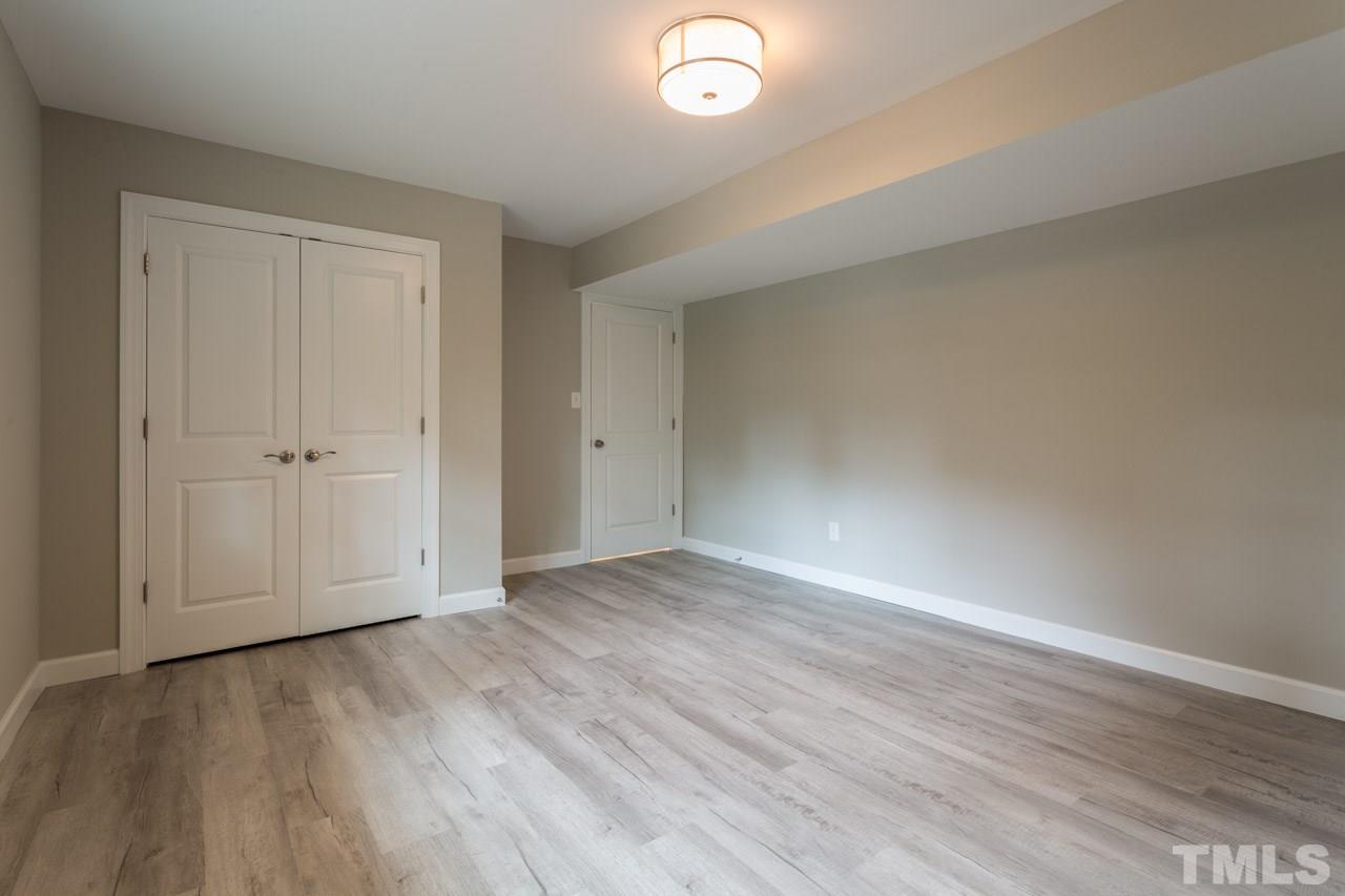 1509 Shadowood Lane Raleigh, NC 27612 - Photo 20 of 25 wooden floor in an empty room