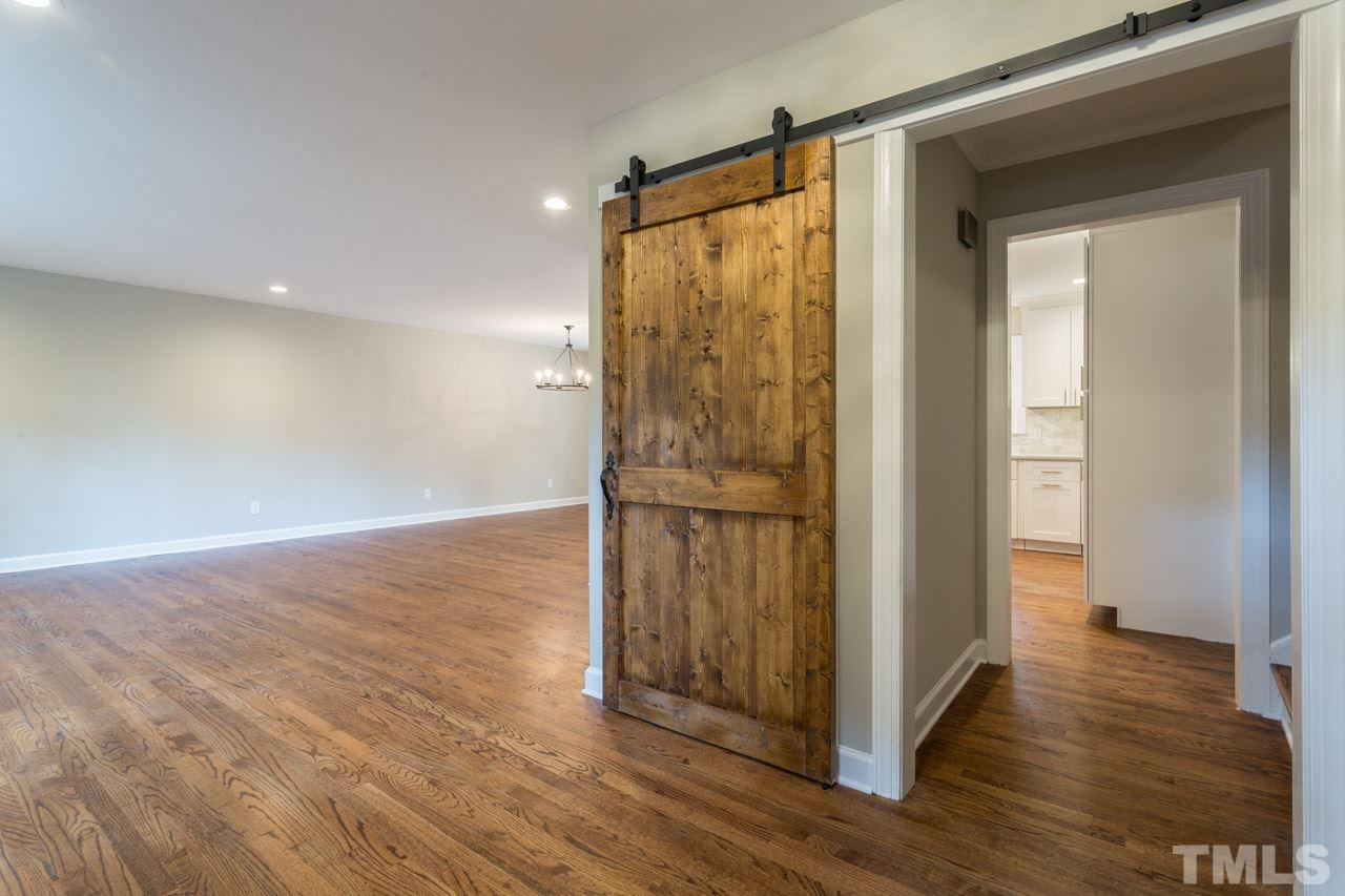 1509 Shadowood Lane Raleigh, NC 27612 - Photo 3 of 25 a view of a bathroom with wooden floor