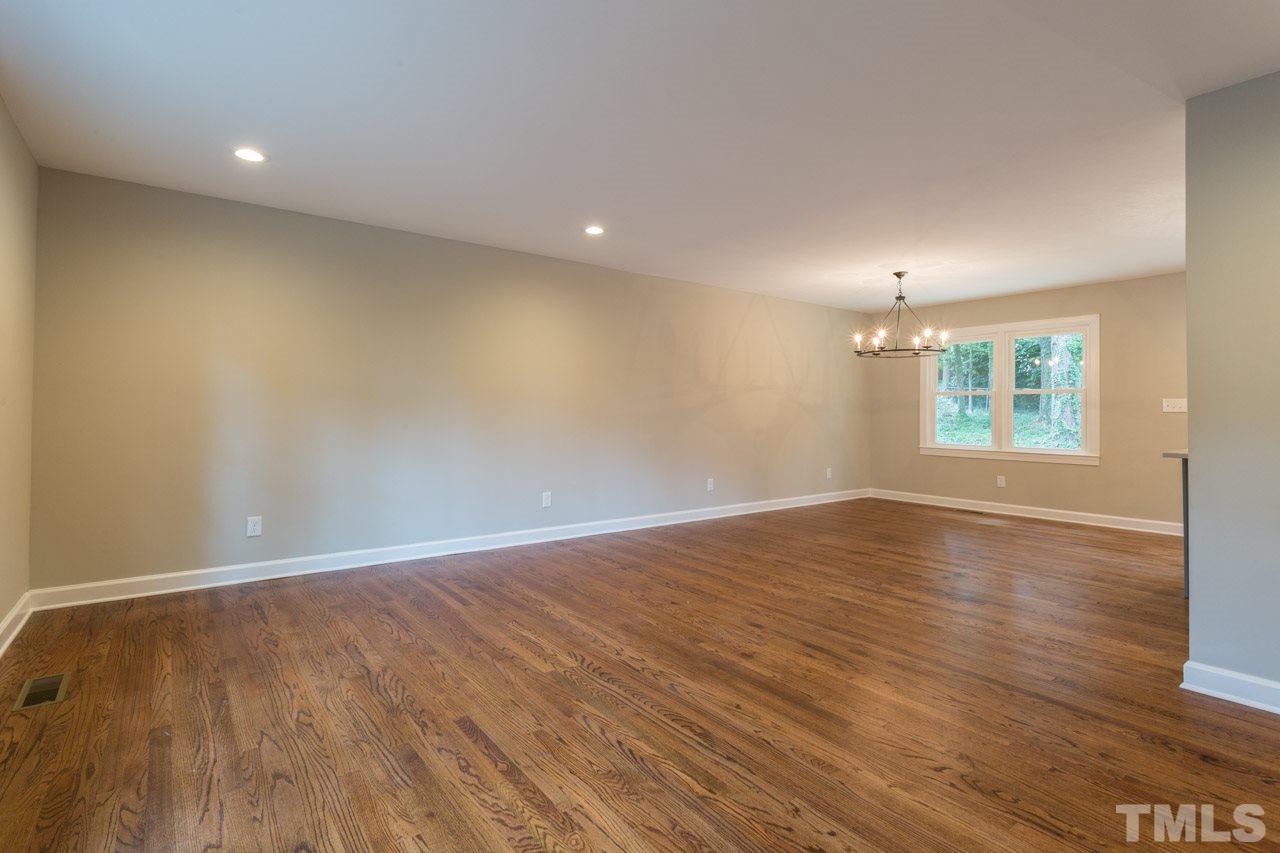 1509 Shadowood Lane Raleigh, NC 27612 - Photo 21 of 25 an empty room with wooden floor and windows