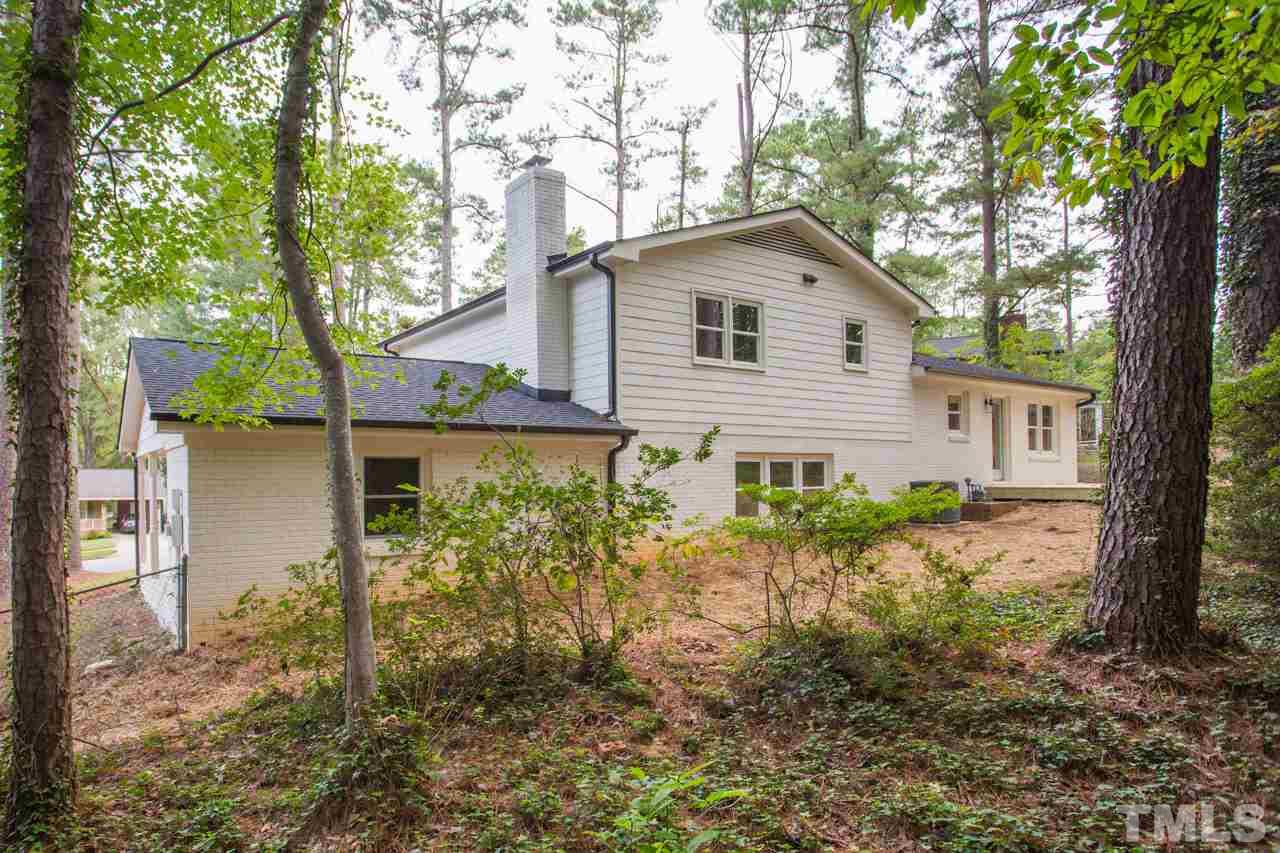 1509 Shadowood Lane Raleigh, NC 27612 - Photo 23 of 25 a backyard of a house with lots of green space