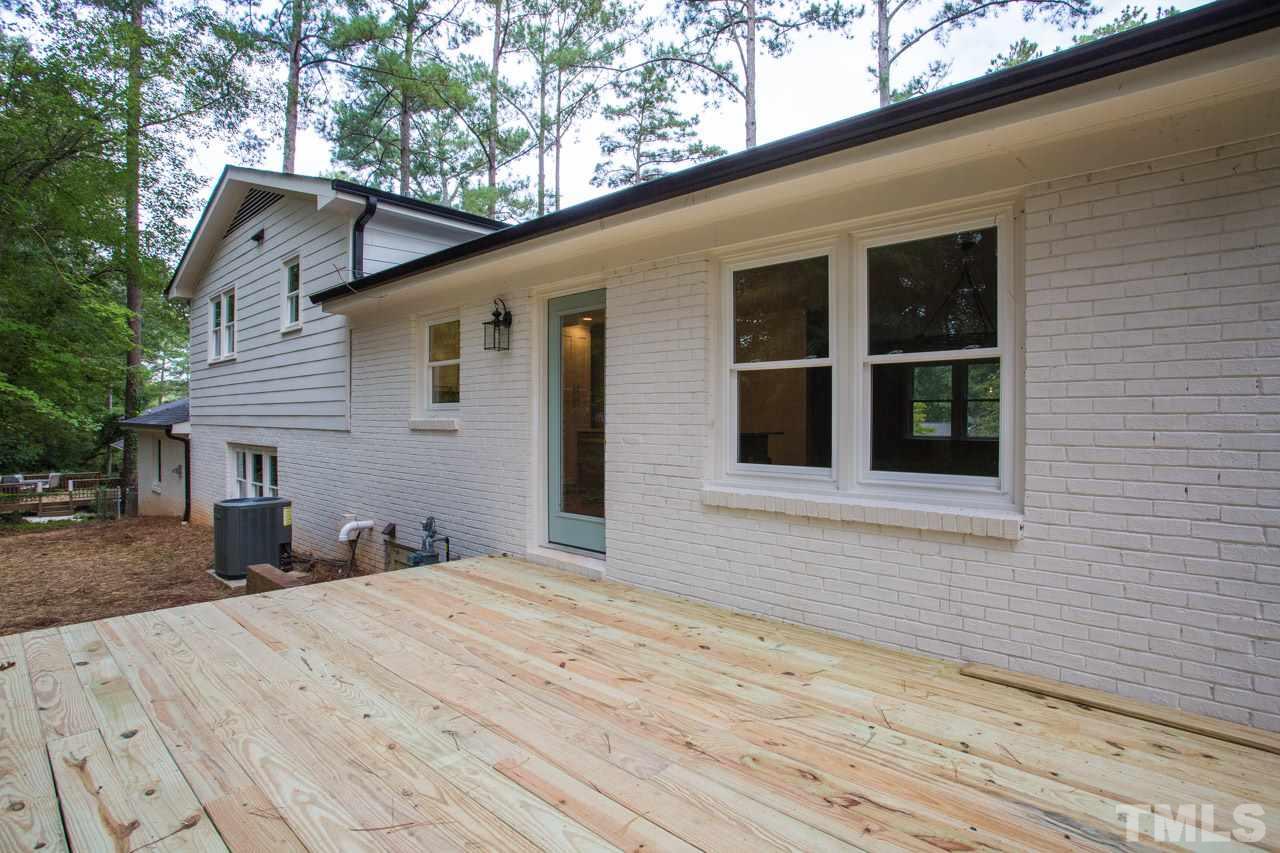 1509 Shadowood Lane Raleigh, NC 27612 - Photo 24 of 25 a view of a house with a backyard