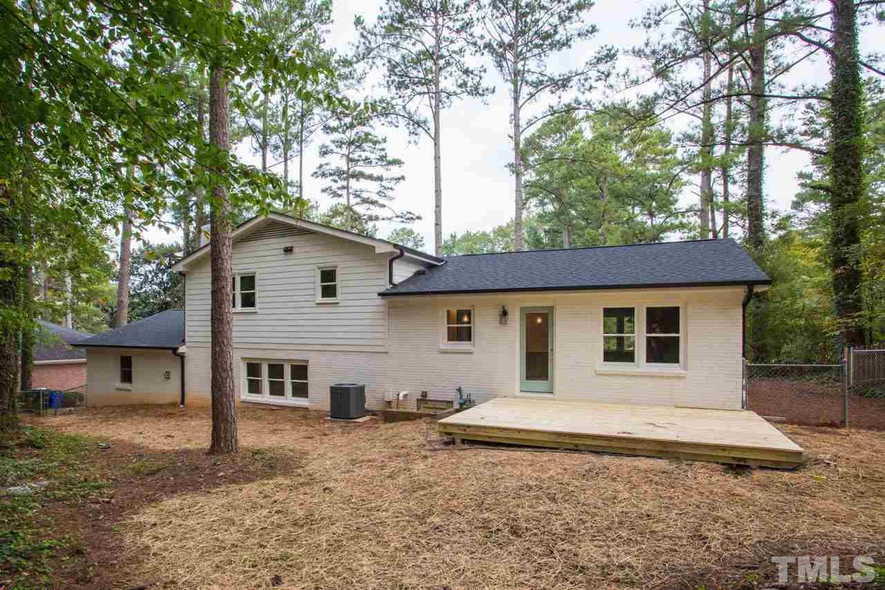 1509 Shadowood Lane Raleigh, NC 27612 - Photo 6 of 25 a house that has a tree in front of it