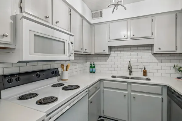 a kitchen with a sink and cabinets