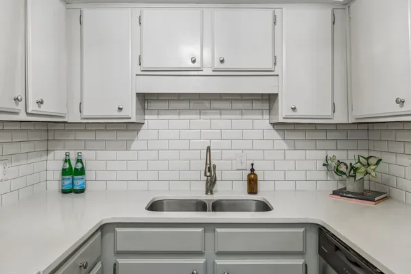 a bedroom with a bed and a potted plant
