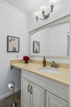 a bathroom with a toilet sink and a mirror