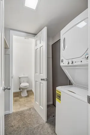 a bedroom with bed and a potted plant