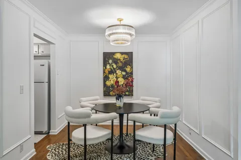 a kitchen with cabinets stainless steel appliances a sink and a window