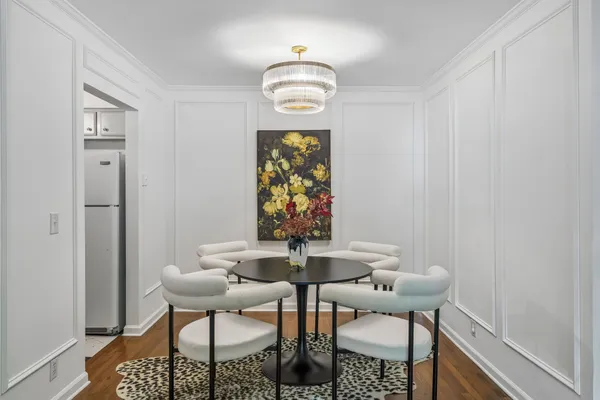 a kitchen with cabinets stainless steel appliances a sink and a window