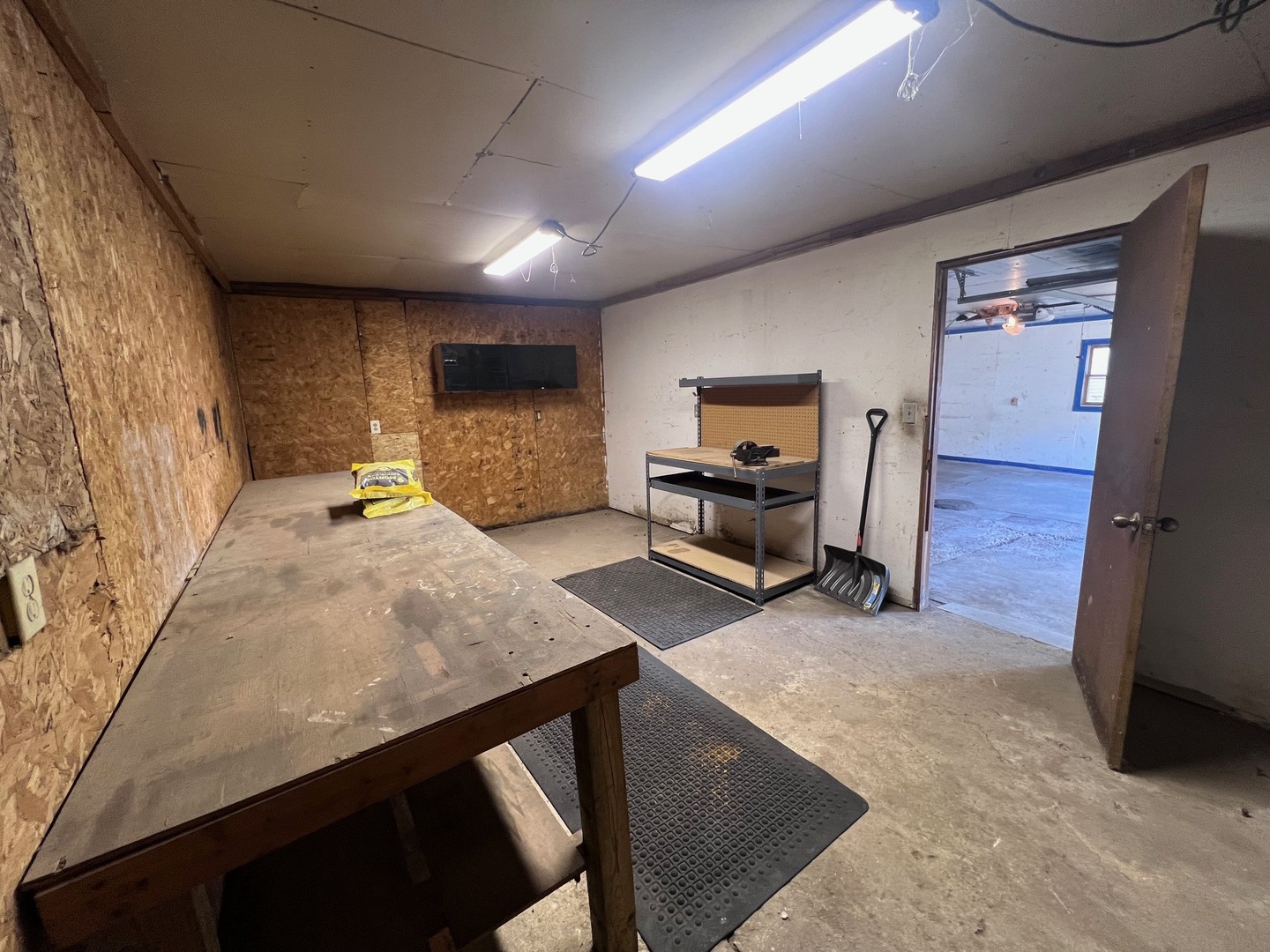 14707 Caledonia Road Caledonia, IL 61011 - Photo 14 of 37 a view of a livingroom with furniture and a flat screen tv