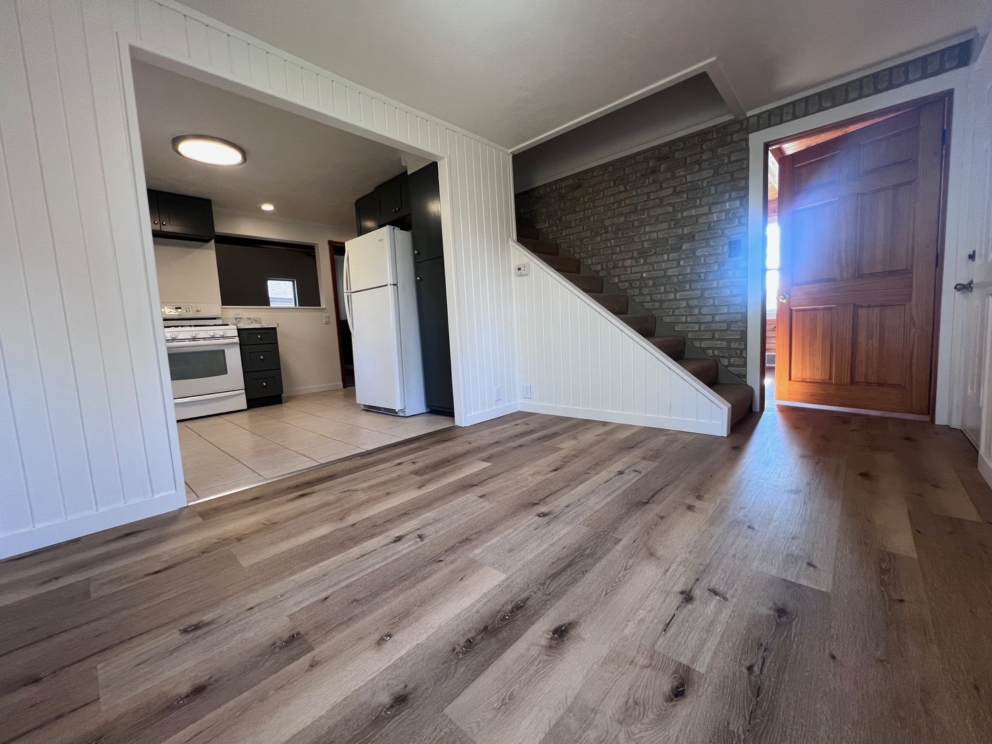 14707 Caledonia Road Caledonia, IL 61011 - Photo 24 of 37 a view of a living room with wooden floor and a kitchen