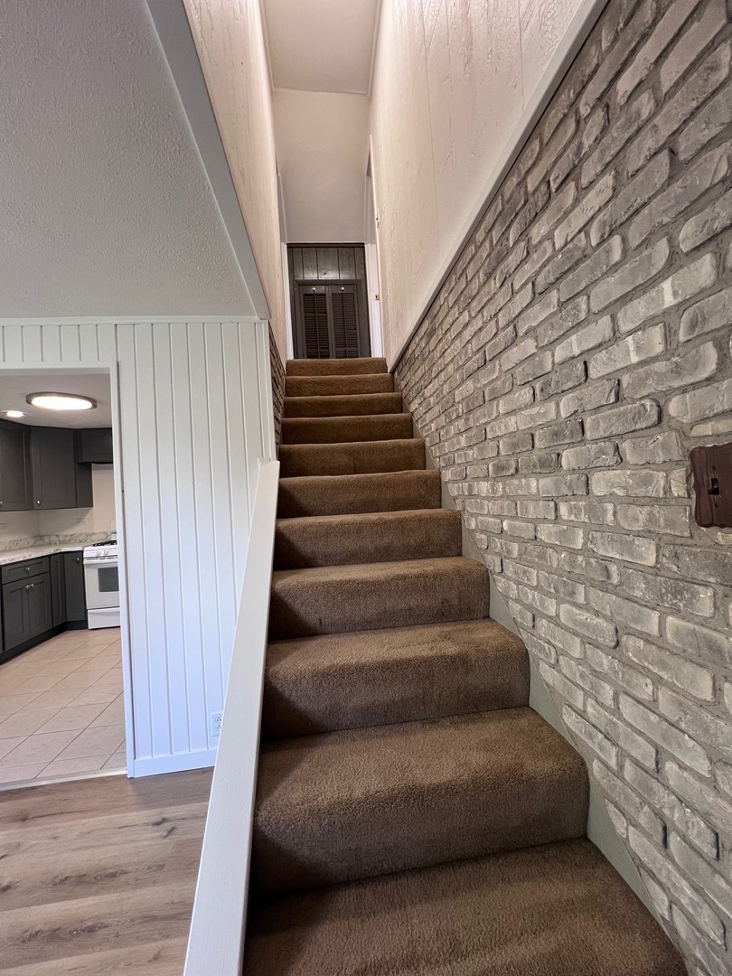14707 Caledonia Road Caledonia, IL 61011 - Photo 29 of 37 a view of entryway bedroom and hall with wooden floor