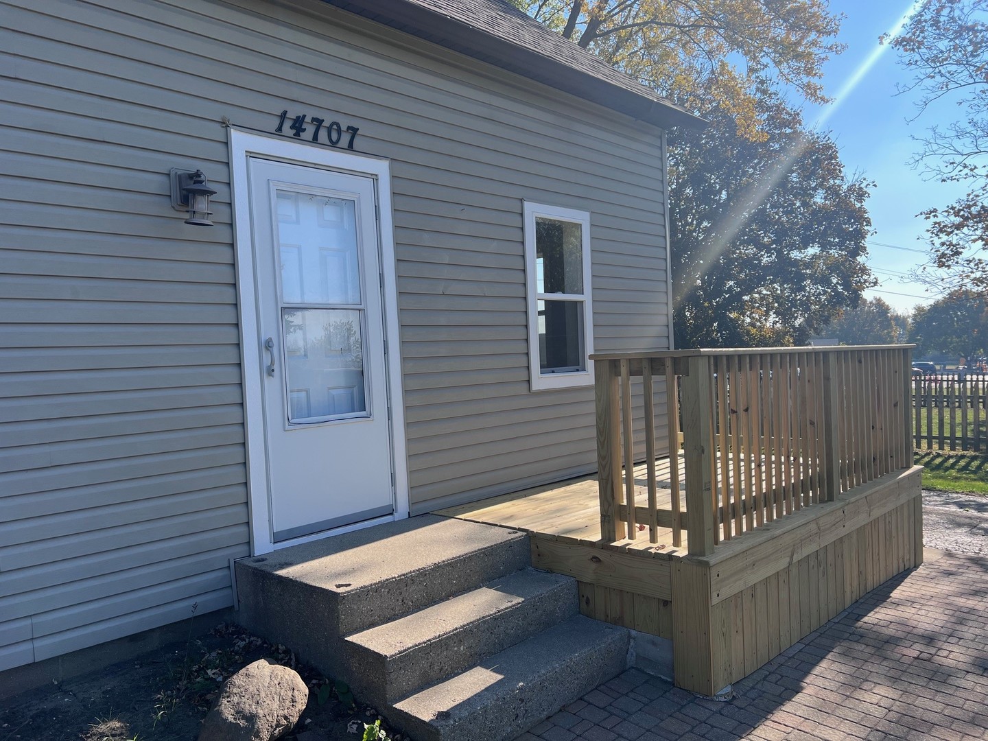 14707 Caledonia Road Caledonia, IL 61011 - Photo 5 of 37 a view of backyard with deck and wooden fence