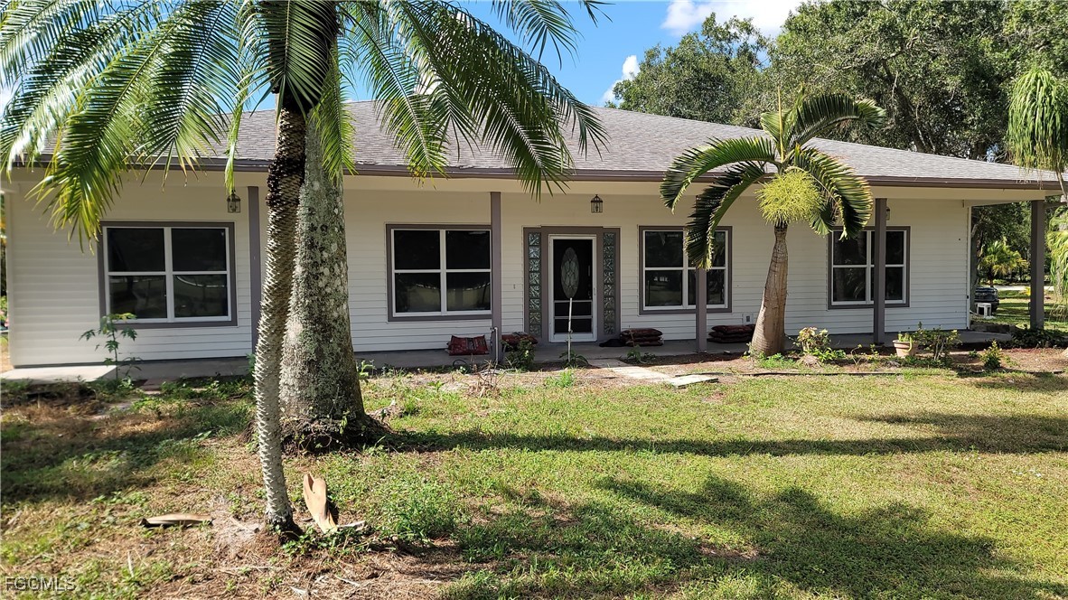 front view of a house with a yard