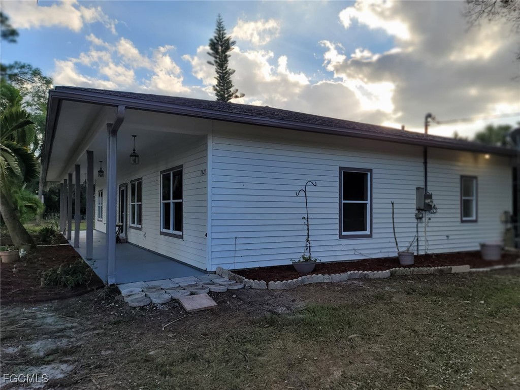 7820 Rich Road North Fort Myers, FL 33917 - Photo 12 of 26 a view of a house with a backyard