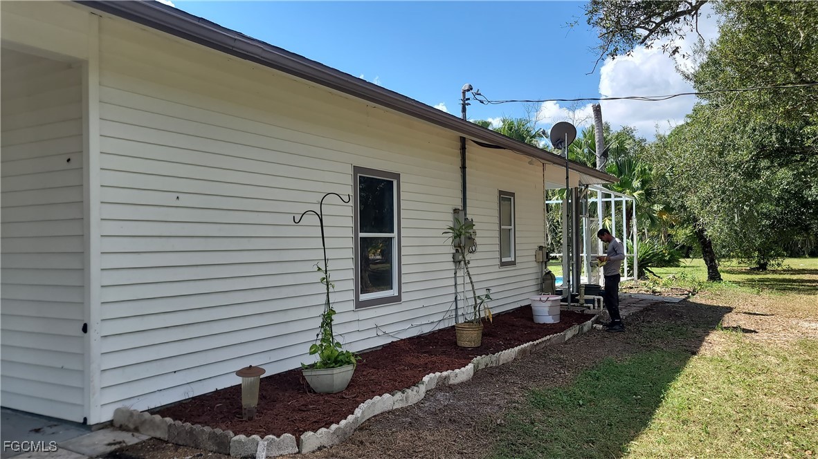 7820 Rich Road North Fort Myers, FL 33917 - Photo 2 of 26 a view of a back yard of the house