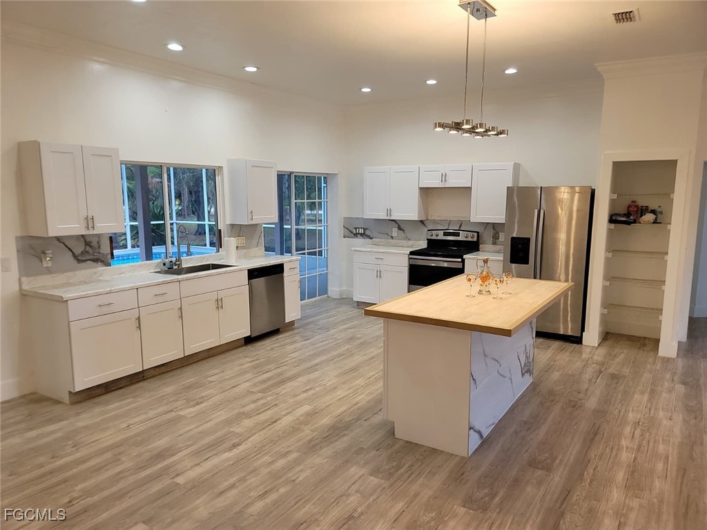 7820 Rich Road North Fort Myers, FL 33917 - Photo 21 of 26 a kitchen with a sink stainless steel appliances and window